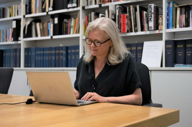 Clare in the archive reading room in 2022. Photograph: Charlie Shepherd