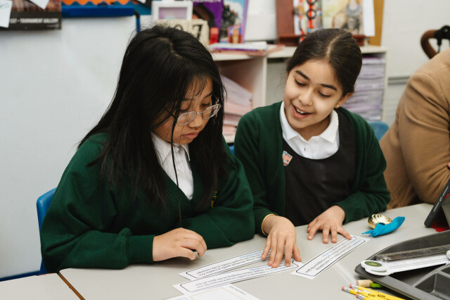 pupils laughing and working together