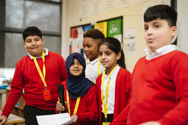 pupils presenting at the front of the class