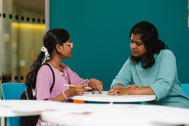Family discussing their NewsWise activity